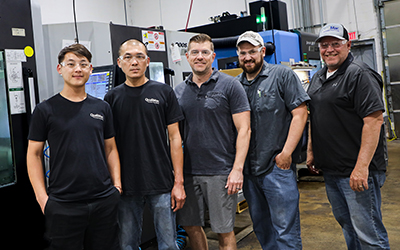 Left to right: Dao Yang, inspection; Lam Thai, Class A machinist; Rob Stone, senior supervisor; Zach Martell, Class A machinist; Brady Bjorgaard, president