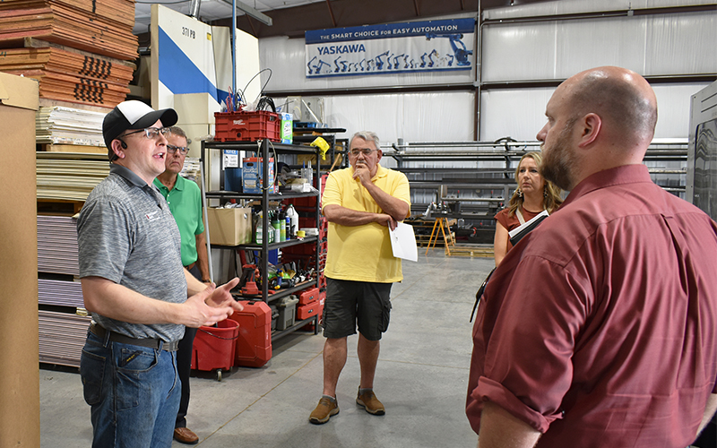 Tyler LeBrun speaks with Senator Bill Weber and Representative Joe Schomacker. 