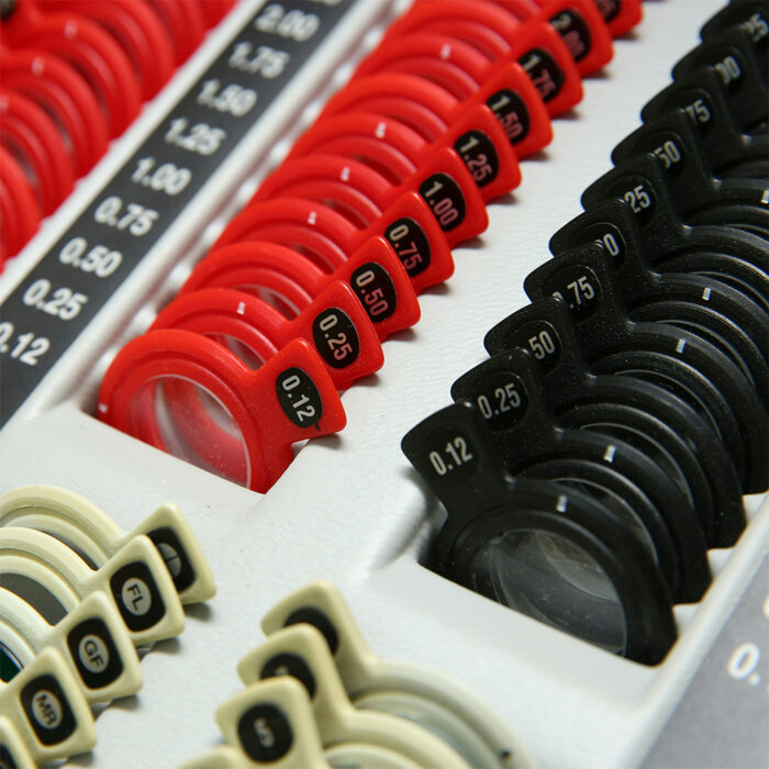 A tray of small medical device lenses.